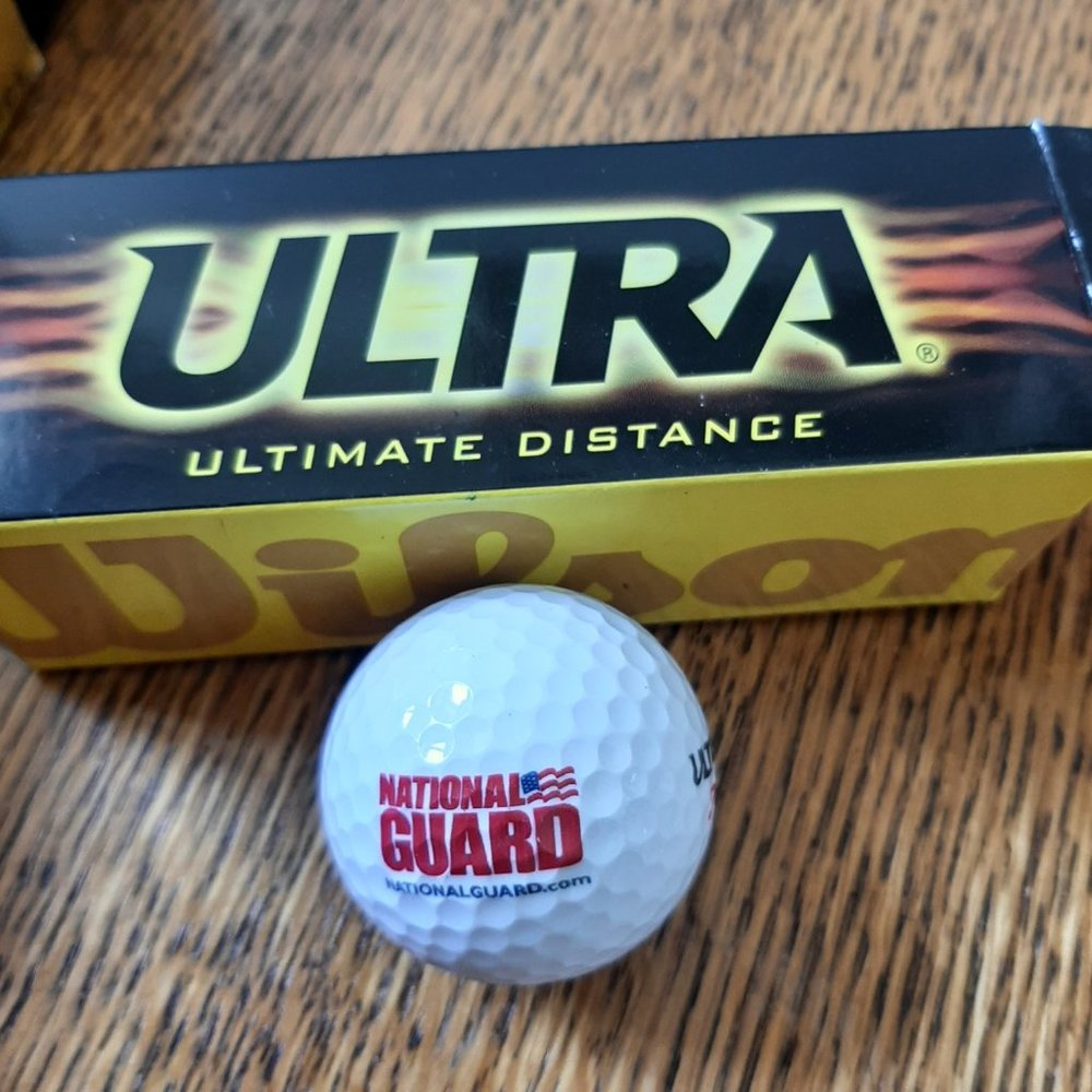 Twelve of Wilson's Ultra Golf Balls, White with National Guard printed on them